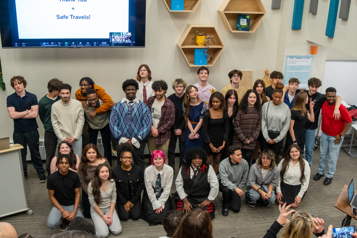 A large group of student participants together at the end of a competition
