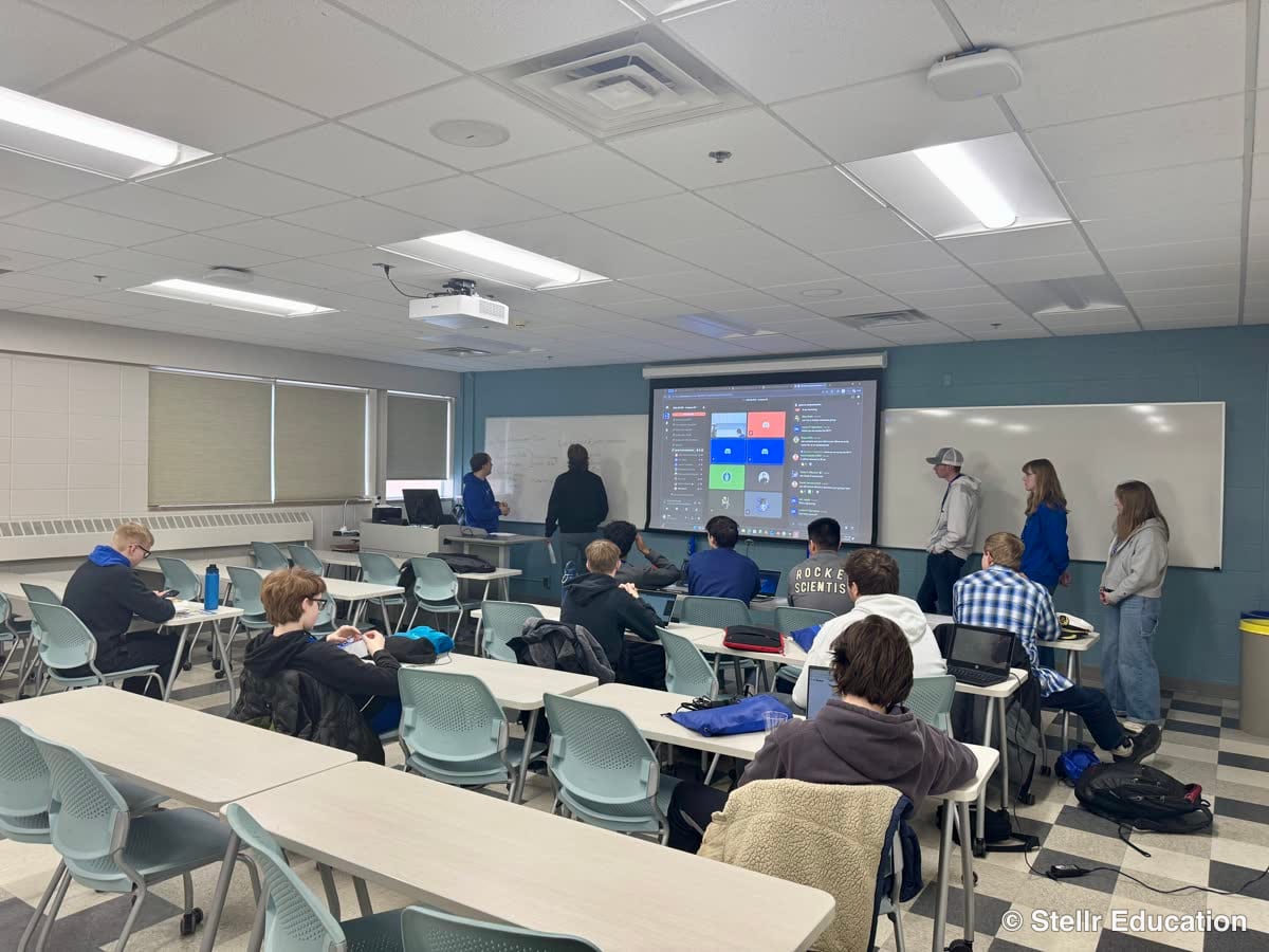 Mentors judging student presentations