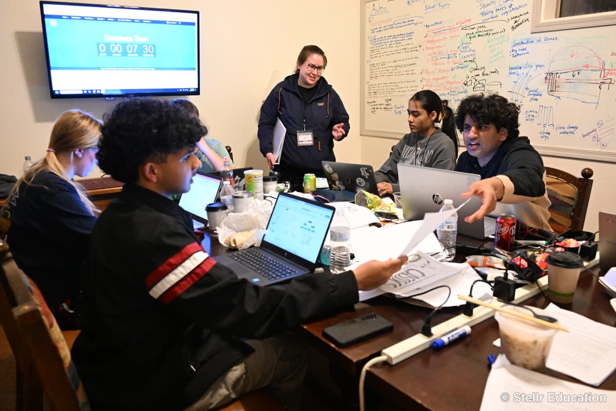 Students at laptops during a design session